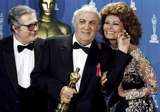 File photo of Italian director Federico Fellini posing with actress Sophia Loren and actor Marcello Mastrioanni in Los Angeles