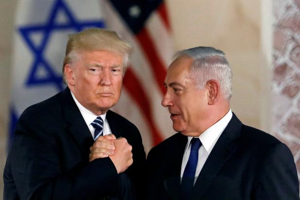 FILE PHOTO: U.S. President Donald Trump and Israeli Prime Minister Benjamin Netanyahu shake hands after Trump's address at the Israel Museum in Jerusalem