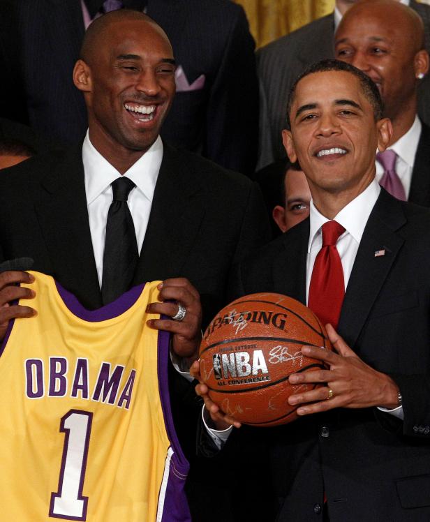 FILE PHOTO: U.S. President Barack Obama shares a laugh with Kobe Bryant during a ceremony honoring the 2009 NBA basketball champions Los Angeles Lakers in the East Room at the White House in Washington
