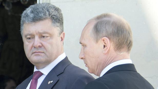 Petro Poroschenko und Wladimir Putin bei einem Treffen.