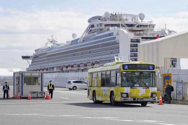 First passengers of quarantined cruise ship disembark, in Japan