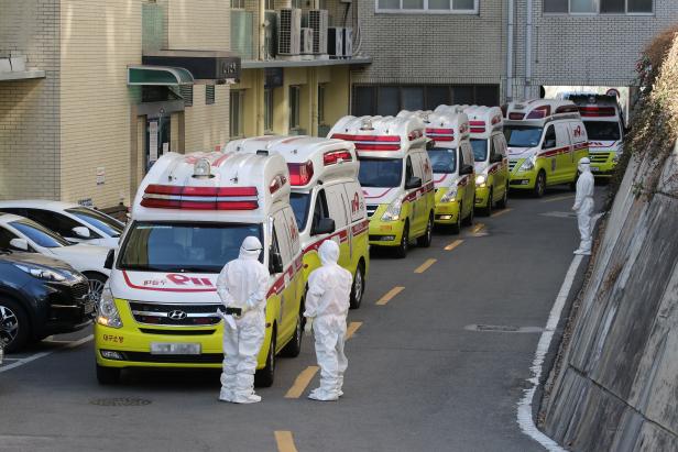 Ambulances transporting confirmed coronavirus patients arrive at a hospital in Daegu