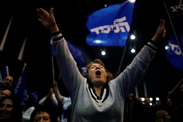 A supporter reacts following the announcement of exit polls in Israel's elections at Israeli Prime Minister Benjamin Netanyahu's Likud party headquarters in Tel Aviv
