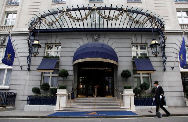 FILE PHOTO: An employee cleans outside the Ritz Hotel in London, Britain