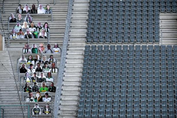 Cardboard cutouts replace supporters at empty soccer stadium in Germany