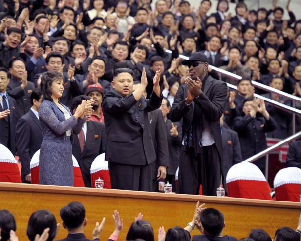 FILE PHOTO: North Korean leader Kim Jong-Un, his wife Ri Sol-Ju and former NBA basketball player Dennis Rodman clap during an exhibition basketball game in Pyongyang