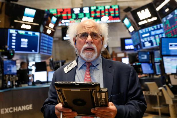Trader Peter Tuchman works on the floor of the NYSE in New York