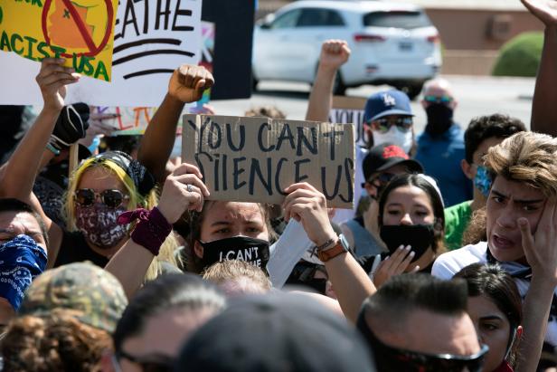 Protestors chant before the visit by U.S, President Donald Trump to the Dream City Church in Phoenix
