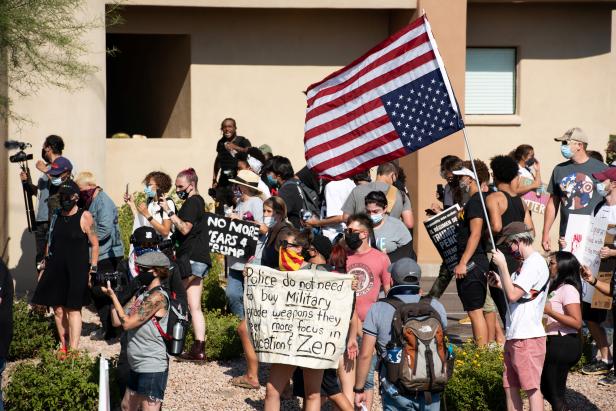 Protestors chant the visit by U.S. President Donald Trump to the Dream City Church in Phoenix