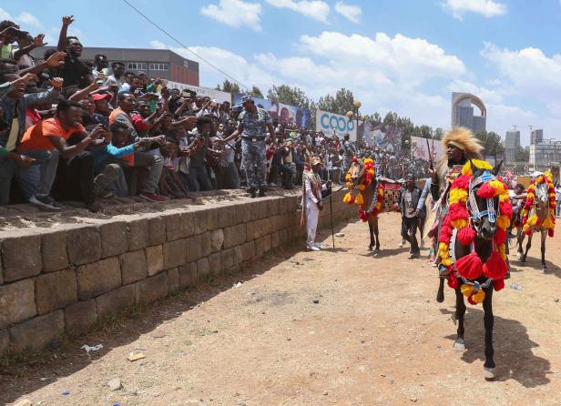 Ethiopian Oromo musician, Haacaaluu Hundeessaa, rides a horse in traditional costume in Addis Ababa