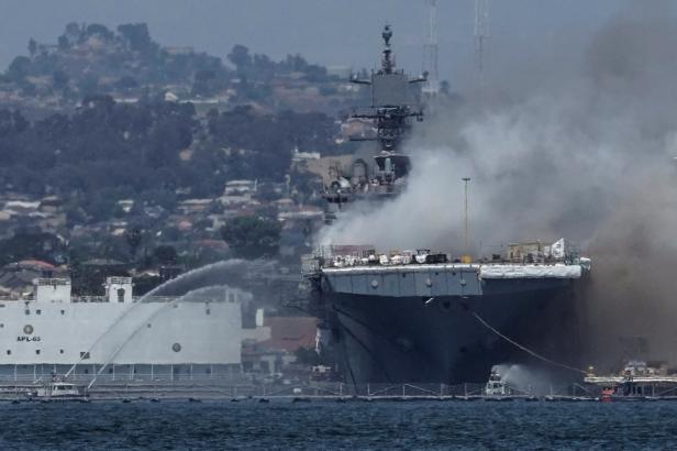 Smoke rises from a fire on board the U.S. Navy amphibious assault ship USS Bonhomme Richard