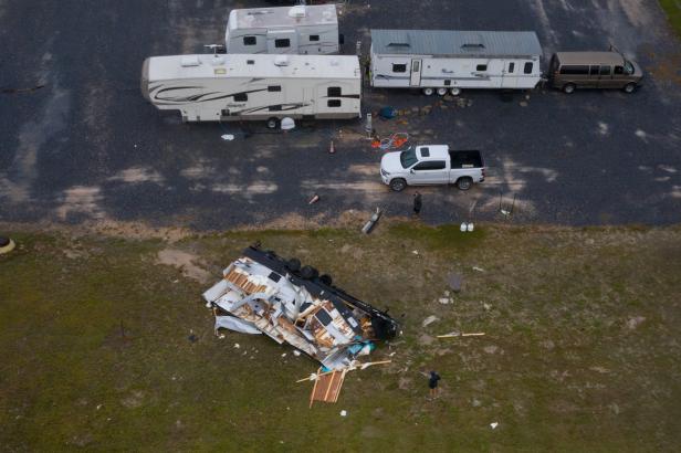 Residents survey destroyed camper trailer in aftermath of Hurricane Hanna in Port Mansfield, Texas