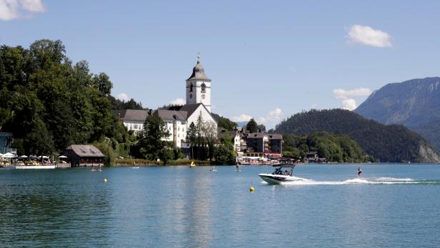 Boat is seen on Lake Wolfgangsee next to St. Wolfgang