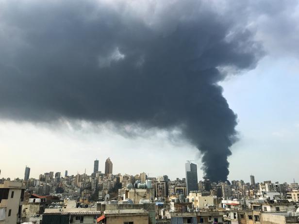 Smoke rises over Beirut's port area as seen from Sin-el-fil