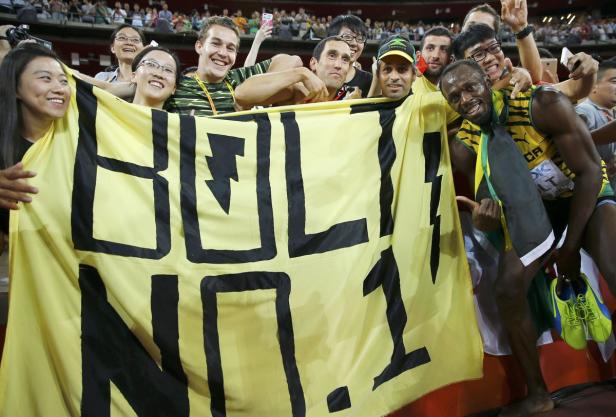Usain Bolt of Jamaica poses for photographs with f