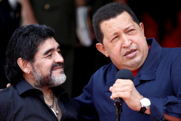 FILE PHOTO: Venezuela's President Hugo Chavez welcomes Argentina's soccer coach Diego Maradona at Miraflores Palace in Caracas