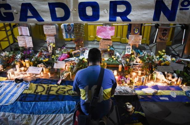 People gather to mourn the death of soccer legend Diego Maradona, outside the Alberto J. Armando "La Bombonera" stadium, in Buenos Aires