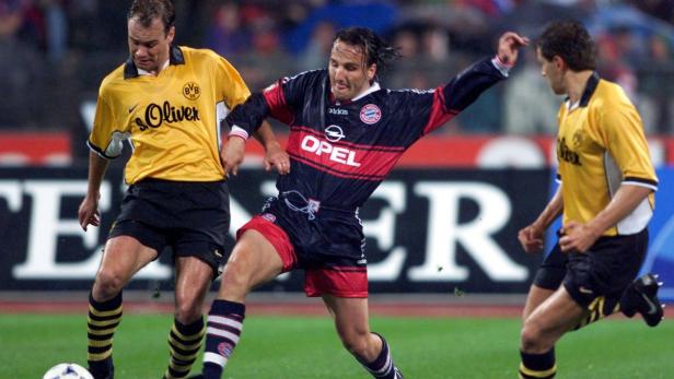 Fußballspieler im Duell zwischen Borussia Dortmund und Bayern München.