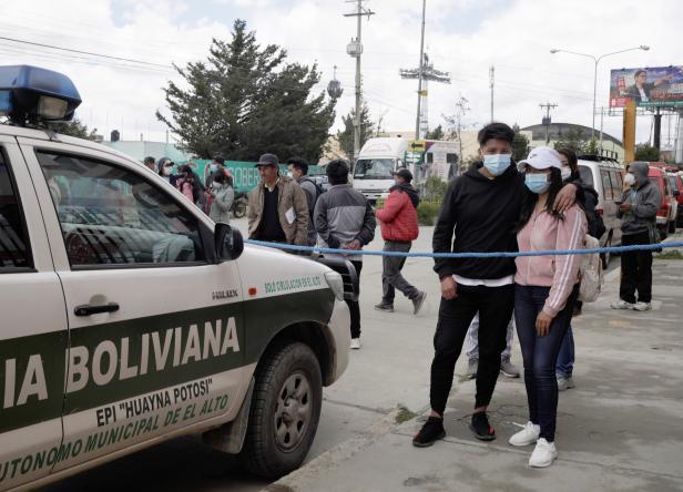 A couple wait for information about the UPEA (El Alto Public University) accident, in El Alto