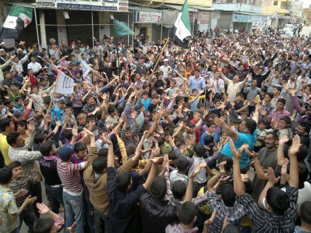 FILE PHOTO: Demonstrators protest against Syria's President Bashar al-Assad after Friday prayers in Maraa