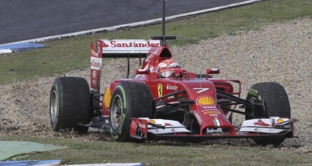 Ein roter Ferrari-Formel-1-Rennwagen auf einer Rennstrecke.