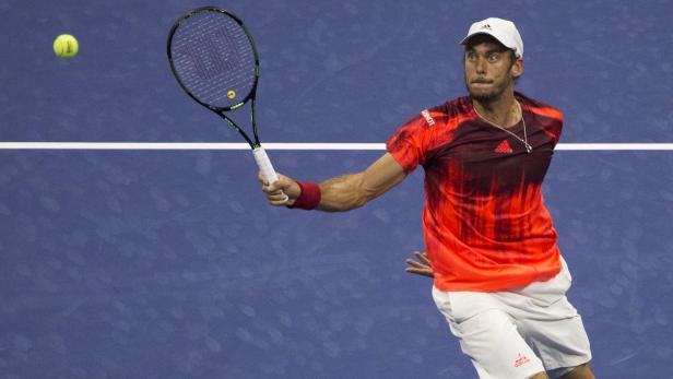 Andreas Haider-Maurer of Austria hits a return dur