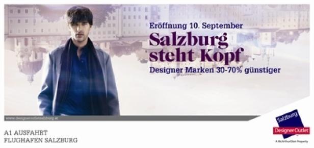 McArthur Glen Designer Outlet Salzburg Eröffnungskampagne/Fessler.Schmidbauer Ein Werbeplakat für das Designer Outlet Salzburg mit einem elegant gekleideten Mann im Vordergrund.