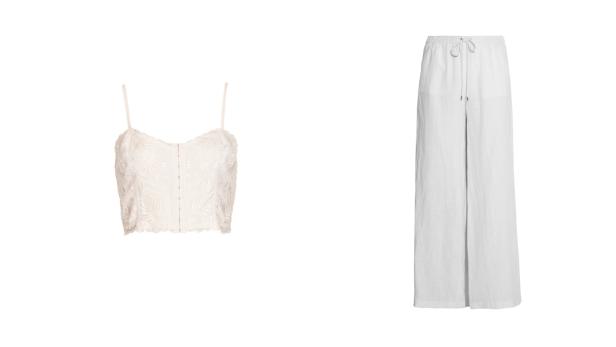 Ein weißes, florales Spitzenoberteil und eine weiße, weite Hose mit Kordelzug.