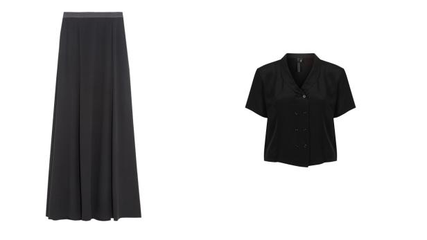 Ein schwarzer, knöchellanger Rock und eine kurzärmelige Bluse auf einem weißen Hintergrund.
