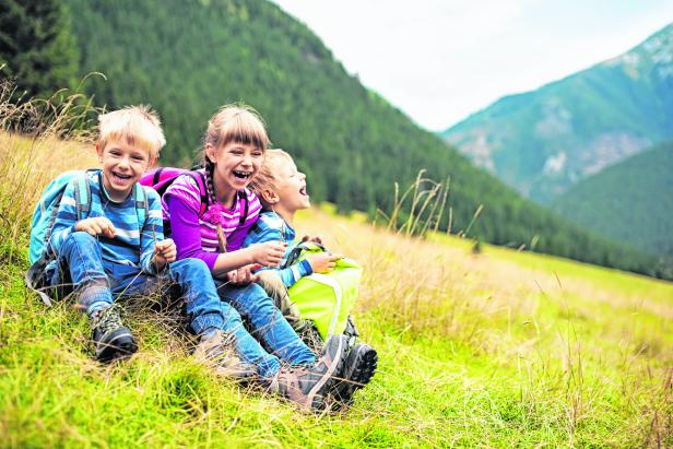 Little hikers resting and laughing