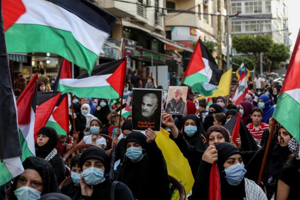 Supporters of Hezbollah and the Palestinian revolution factions protest in southern suburb of Beirut

