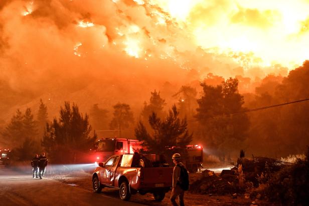 Wildfire raging in a forested area in Schino, Loutraki