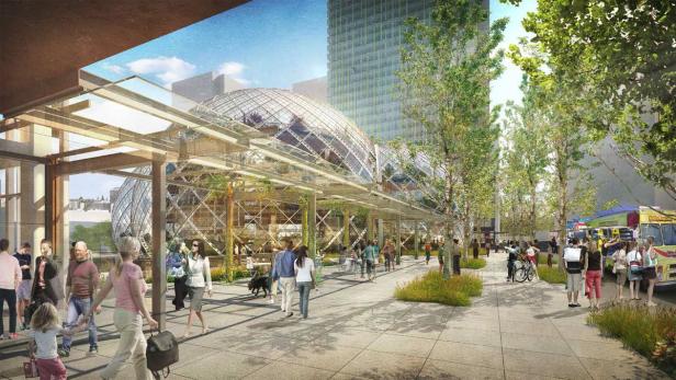 Eine belebte Fußgängerzone mit Blick auf die Kuppelstruktur der Amazon Spheres in Seattle.