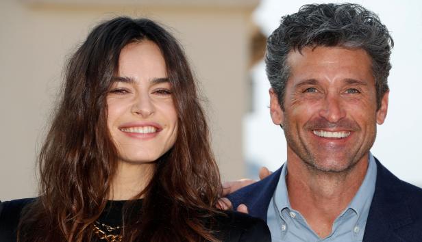 Actors Patrick Dempsey and Kasia Smutniak pose during a photocall for the television series "Devils" during the annual MIPCOM television programme market in Cannes