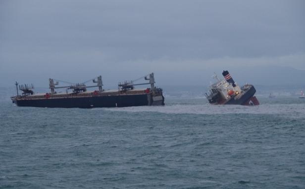 Handout photo released by Japan Coast Guard shows the Panamanian-registered ship 'Crimson Polaris' after it ran aground in Hachinohe harbour in Hachinohe, Japan