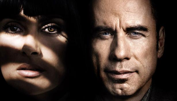 Porträt von Uma Thurman und John Travolta im Gegenlicht.