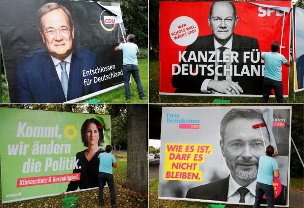 FILE PHOTO: Placards being placed on boards in Bonn for Germanys general election on September 26