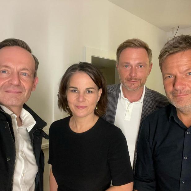 German politicians Volker Wissing and Christian Lindner of the FDP, together with Annalena Baerbock and Robert Habeck of the Greens, pose for a selfie photograph, in this picture obtained from social media