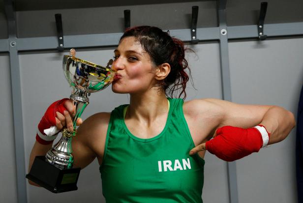 Iranian boxer Sadaf Khadem poses in the locker room after winning the fight against French boxer Anne Chauvin during an official boxing bout in Royan