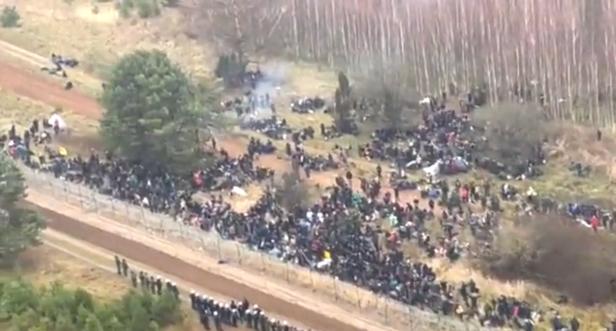 Migrants are seen on the Belarus side of the border with Poland near Kuznica Bialostocka