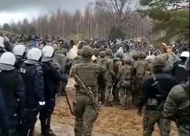 Polish police and border guard block hundreds of migrants who try to cross from the Belarus side of the border with Poland near Kuznica Bialostocka