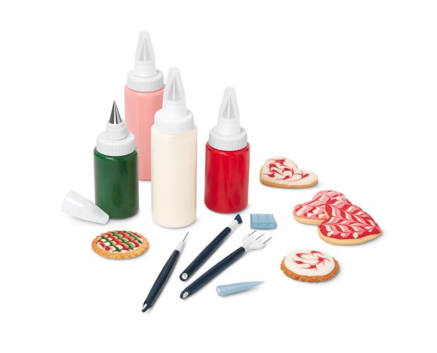 Ein Set zum Dekorieren von Keksen mit farbiger Zuckerguss und Werkzeugen.