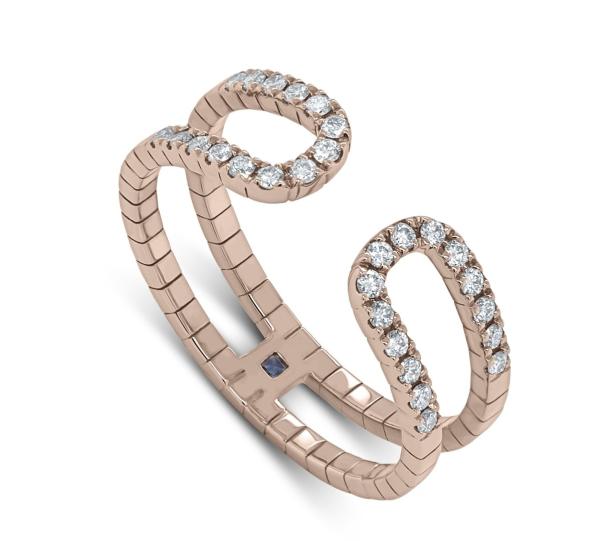 Ein offener Ring aus Roségold, besetzt mit Diamanten und einem kleinen blauen Stein.