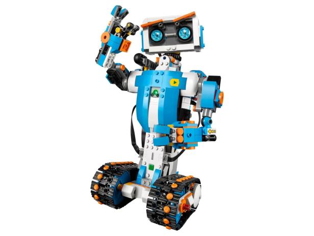 Ein blauer und weißer Spielzeugroboter mit Kettenrädern hebt einen Arm.