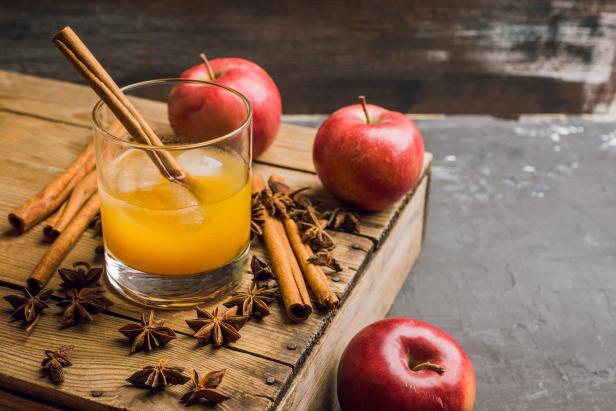 Old fashioned apple beverage on the rustic background