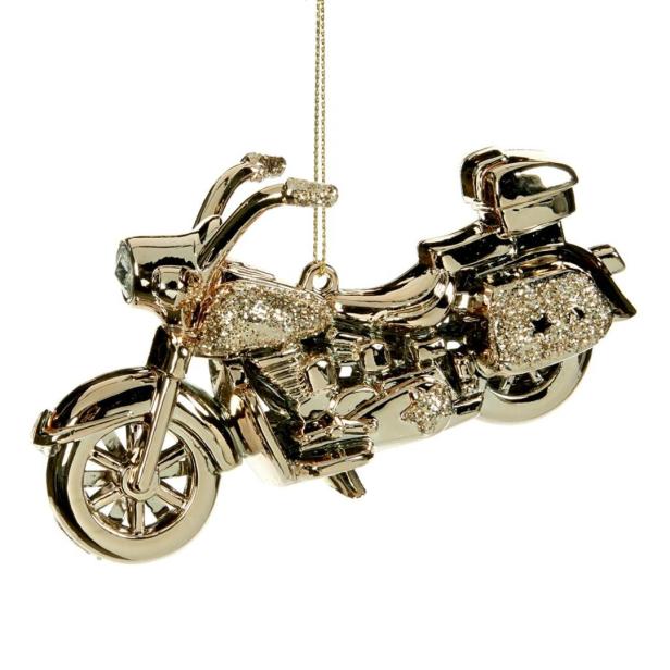 Ein goldfarbener Motorrad-Weihnachtsbaumschmuck hängt an einer Kette.