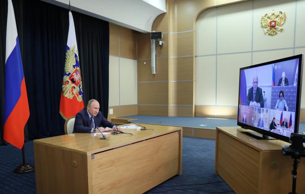 Russian President Vladimir Putin chairs a meeting via a video link in Sochi