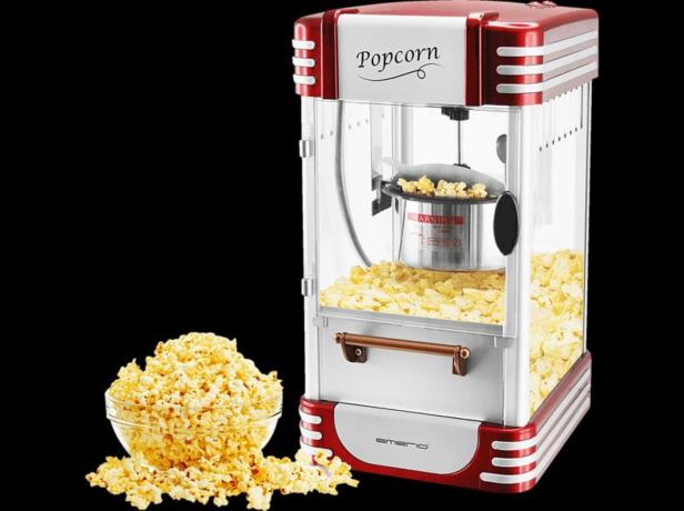 Eine Popcornmaschine im Retro-Stil mit einer Schüssel Popcorn davor.