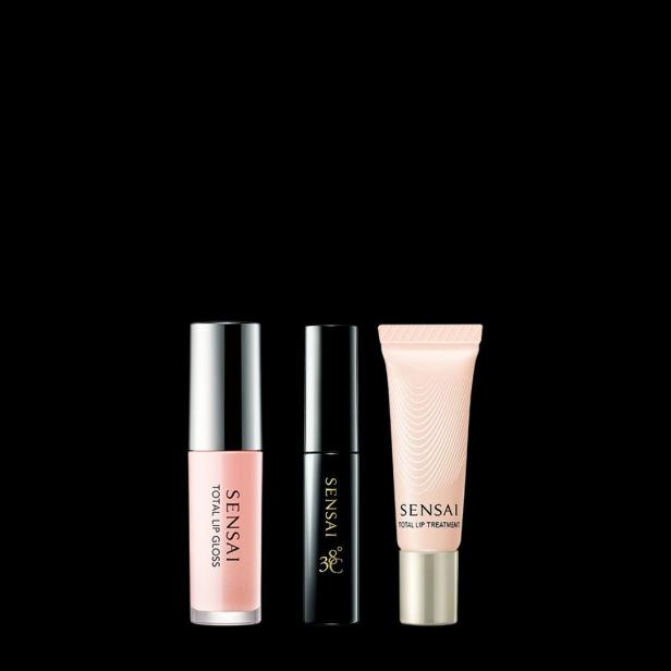 Drei Produkte von Sensai zur Lippenpflege vor einem schwarzen Hintergrund.