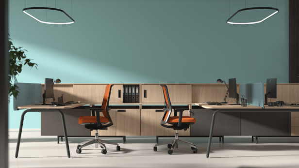 Ein modernes Büro mit zwei Arbeitsplätzen und orangefarbenen Bürostühlen.